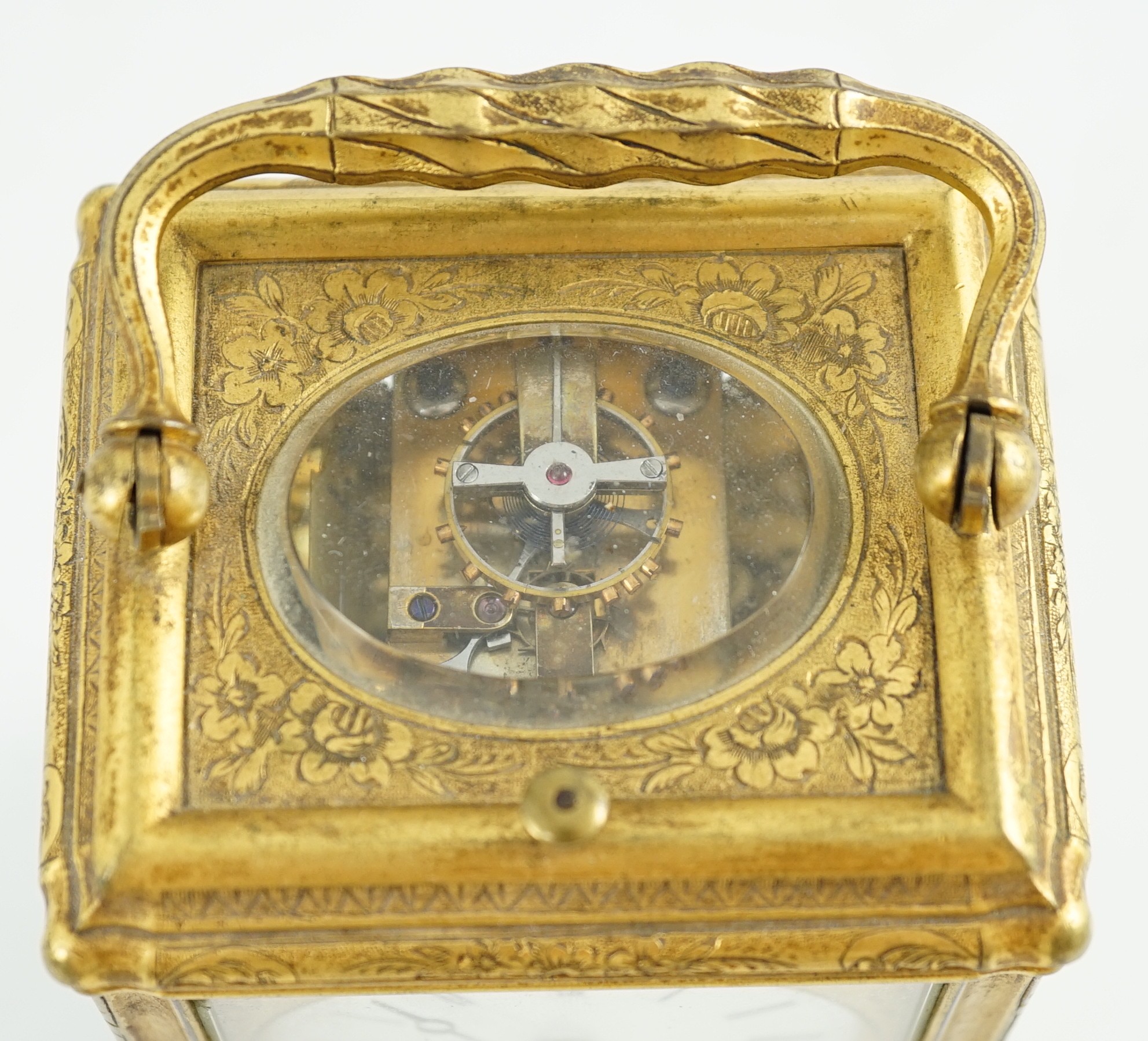 A late 19th century French engraved gilt brass gorge-cased repeating carriage clock with alarm, width 7.5cm depth 6.5cm height 11.5cm